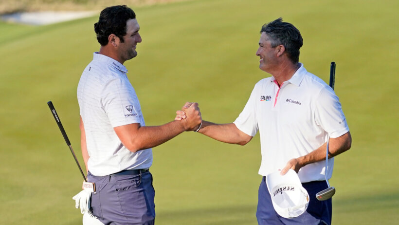 Jon Rahm shaking hands with Ryan Palmer during the third round at the Dell Technologies Match Play Championship.