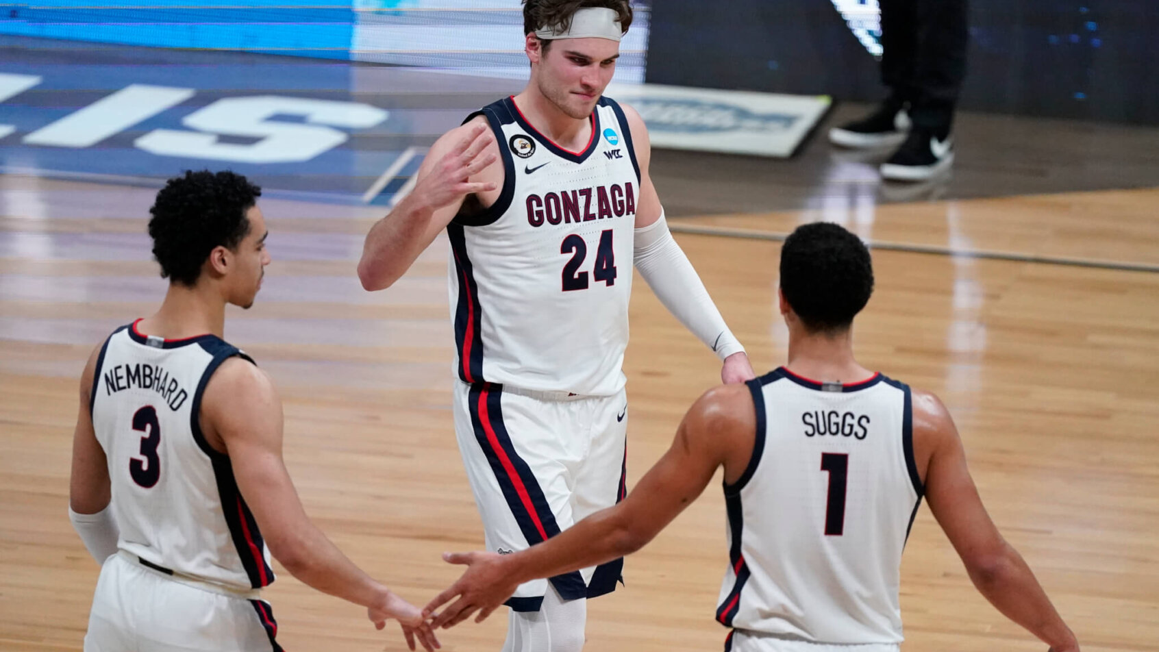 Corey Kispert, Jalen Suggs, and Andrew Nembhard celebrating
