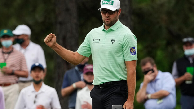 Corey Conners celebrates a birdie at the Masters