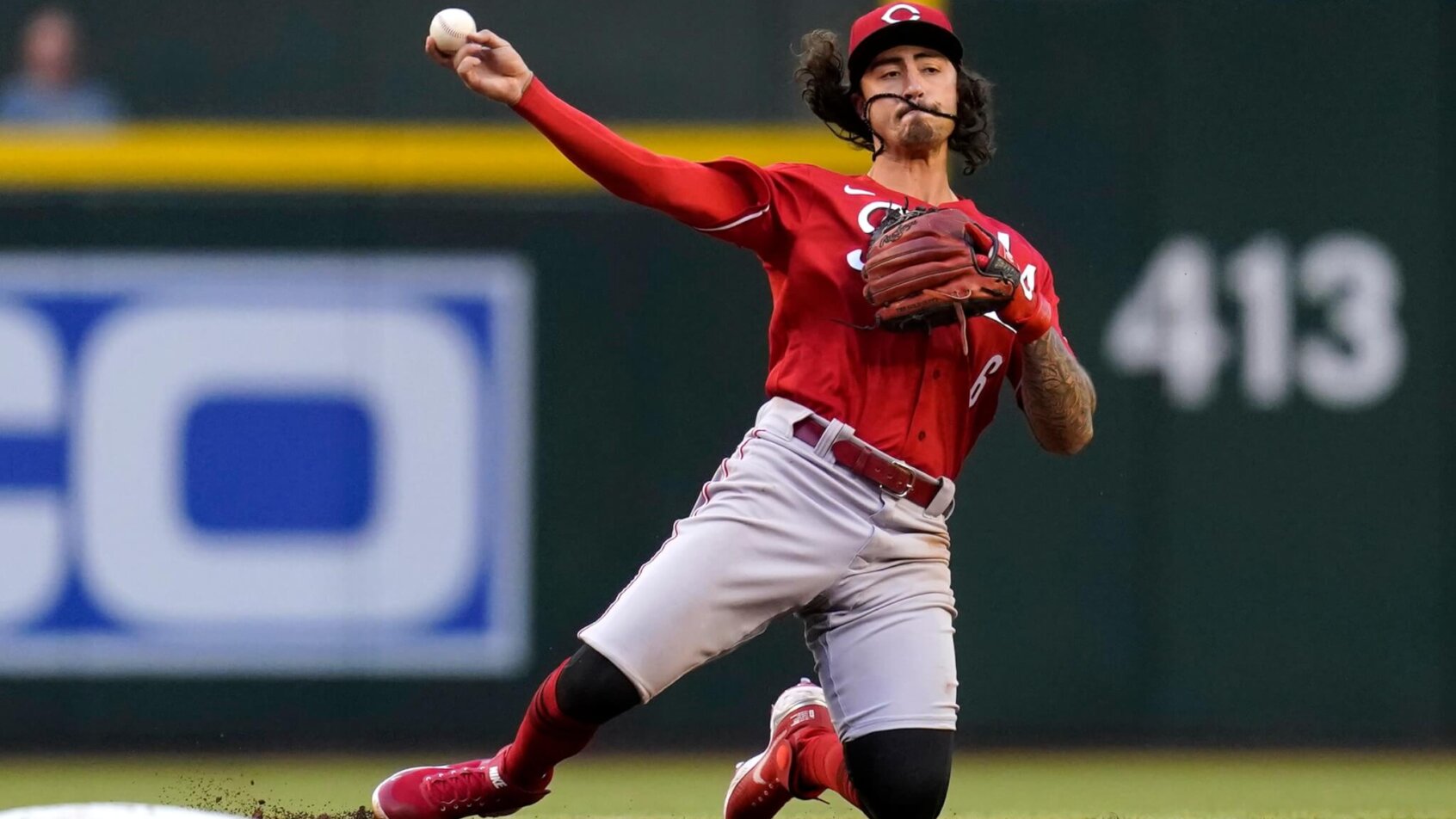 Cincinnati Reds second baseman Jonathan India throwing from his knees