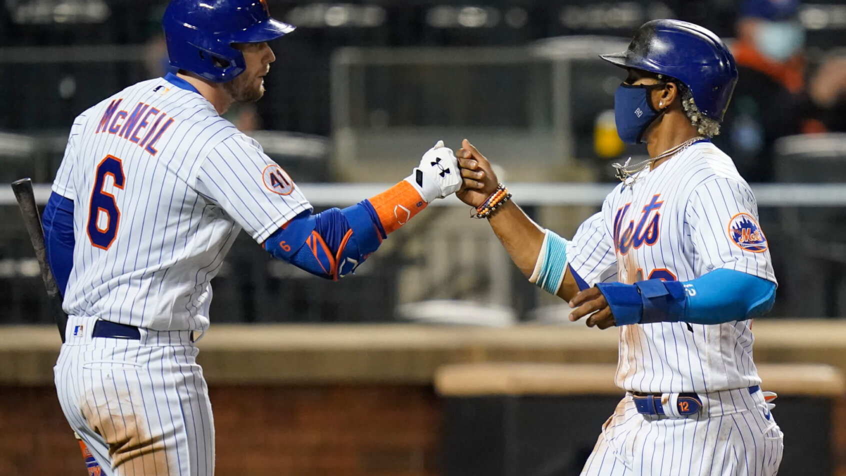 Jeff McNeil fist bumps Francisco Lindor