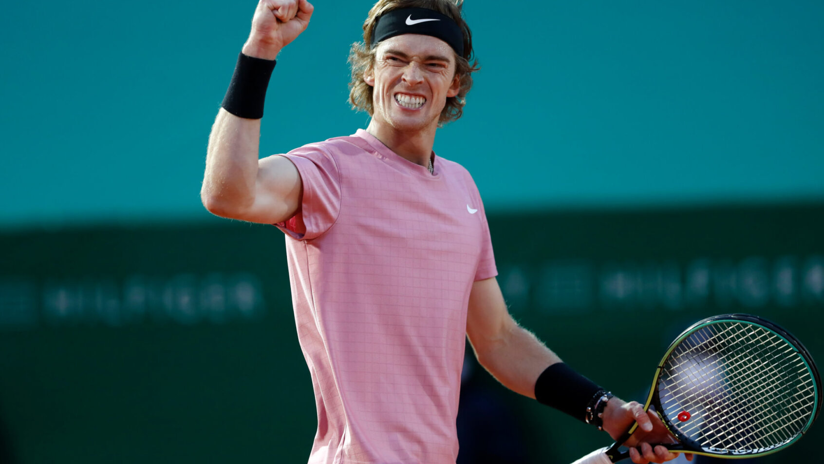 Andrey Rublev reacting with a fist pump after scoring a point during a tennis match at the Monte-Carlos Masters.