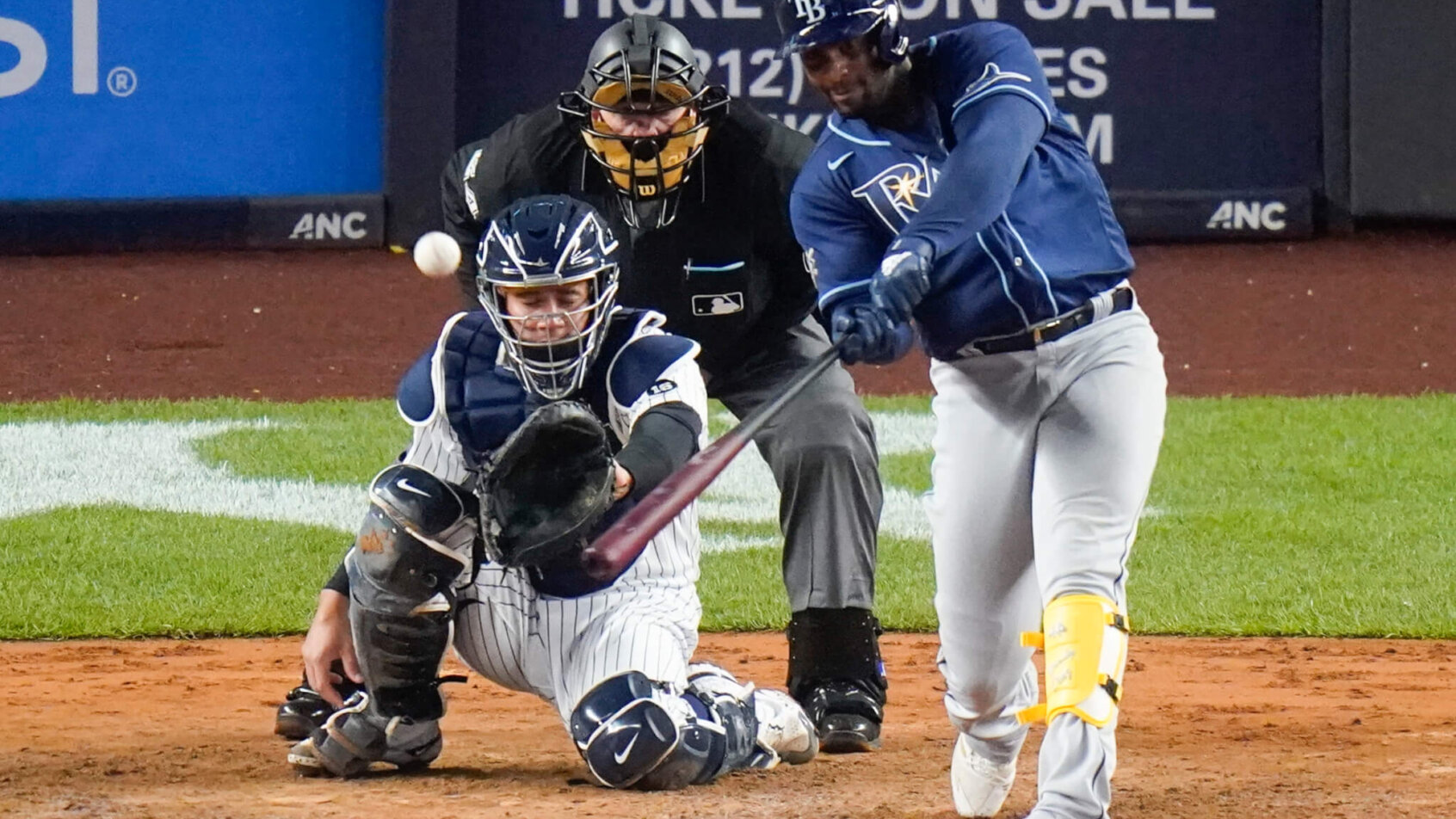 Yandy Diaz swinging at pitch