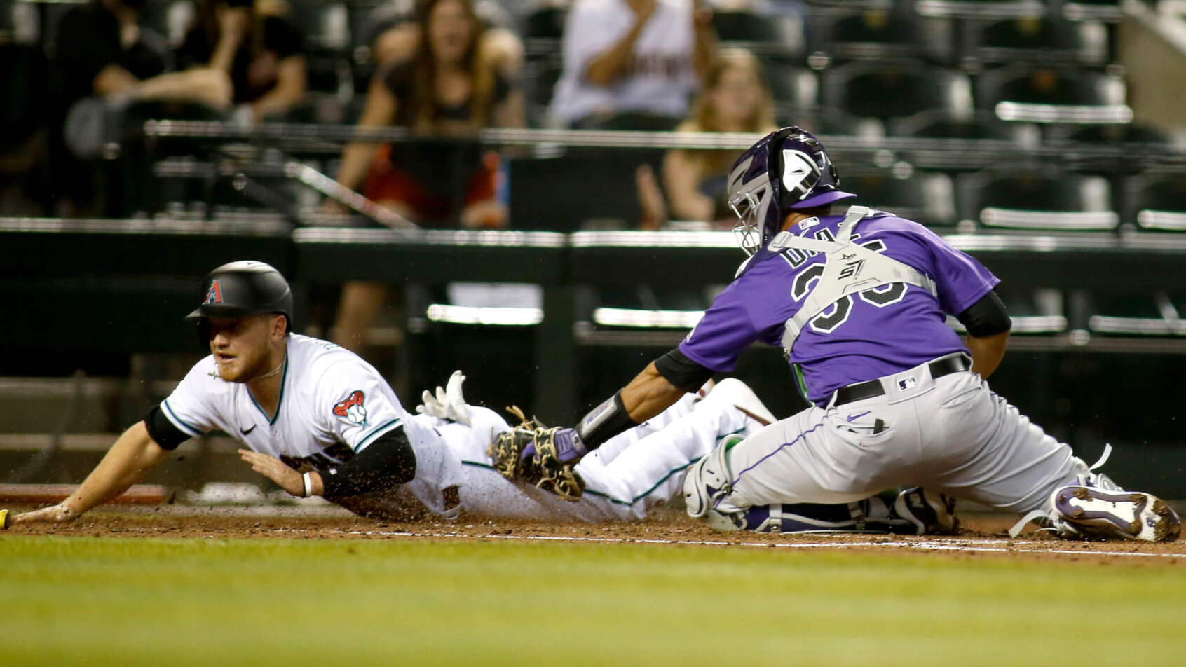 Josh VanMeter slides into home