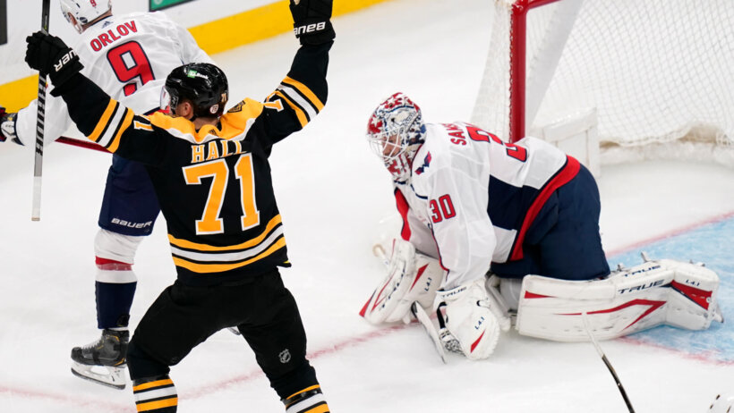 Taylor Hall celebrating with his hands up after scoring a goal on the Washington Capitals.