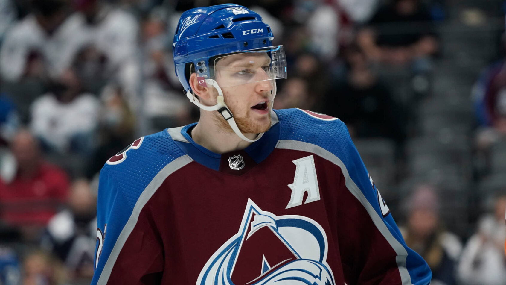 A mid shot of Colorado Avalanche center Nathan MacKinnion on the ice during a NHL playoff hockey game.