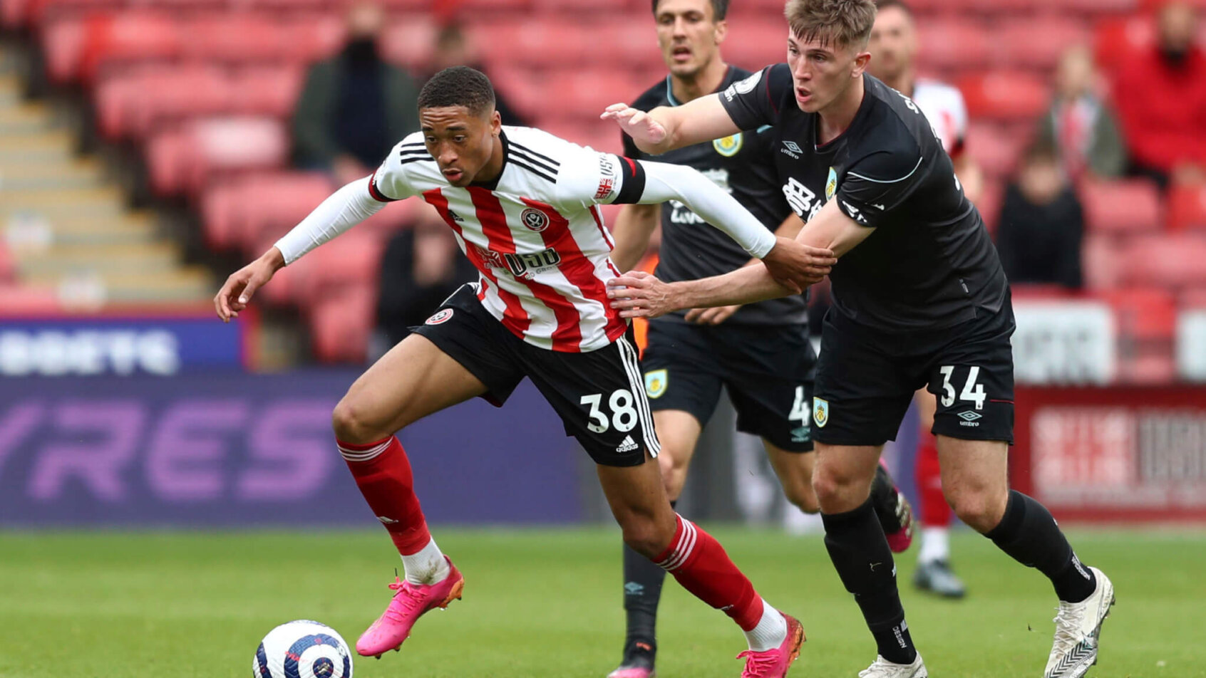 Daniel Jebbison, left, and Jimmy Dunne battle for ball