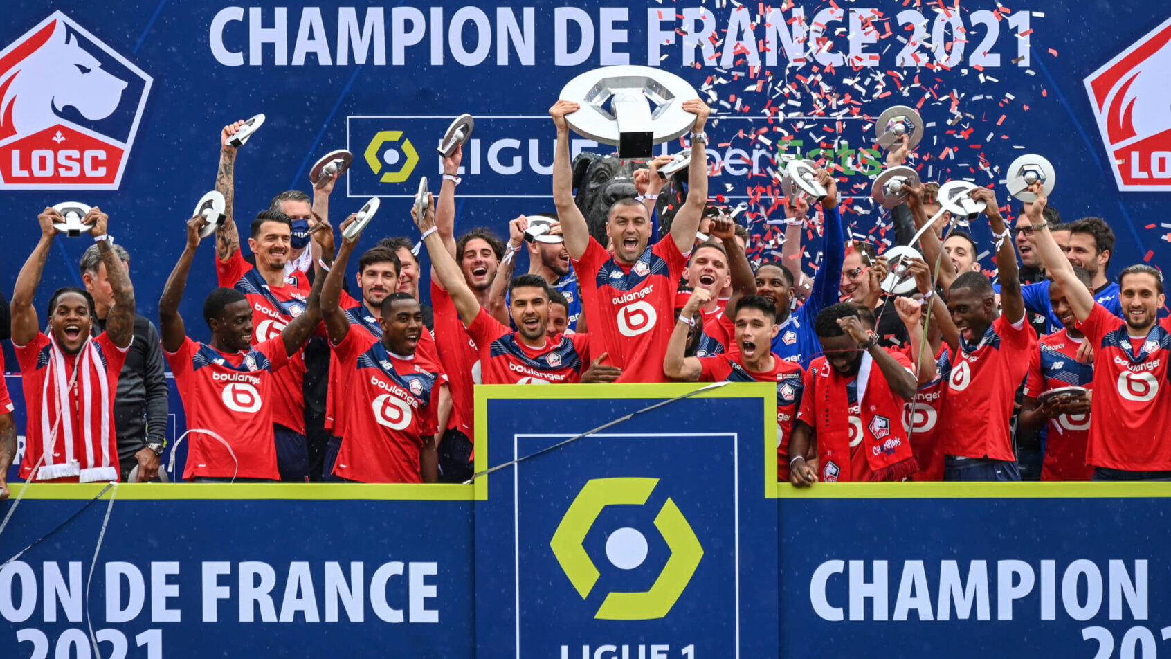Lille players posing with the trophy celebrating winning the French League One Soccer.