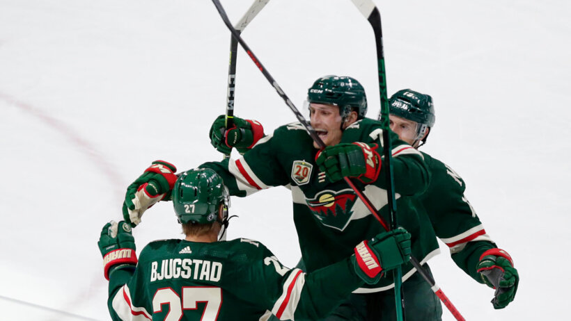 Minnesota Wild players celebrate goal