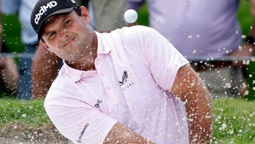 Patrick Reed plays out of the bunker