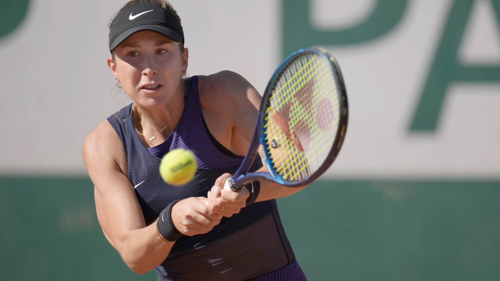 Belinda Bencic hitting a return during her first round match at the 2021 French Open.