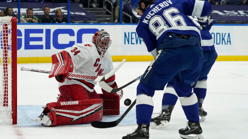 Carolina Hurricanes goaltender Petr Mrazek stops a shot by Tampa Bay Lightning's Nikita Kucherov during a NHL playoff game.