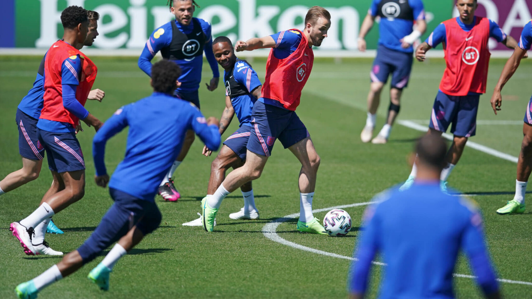 England players controlling the ball during a training session.