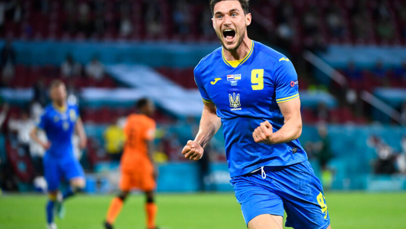 Roman Yaremckuk celebrating after scoring a goal during a soccer match.