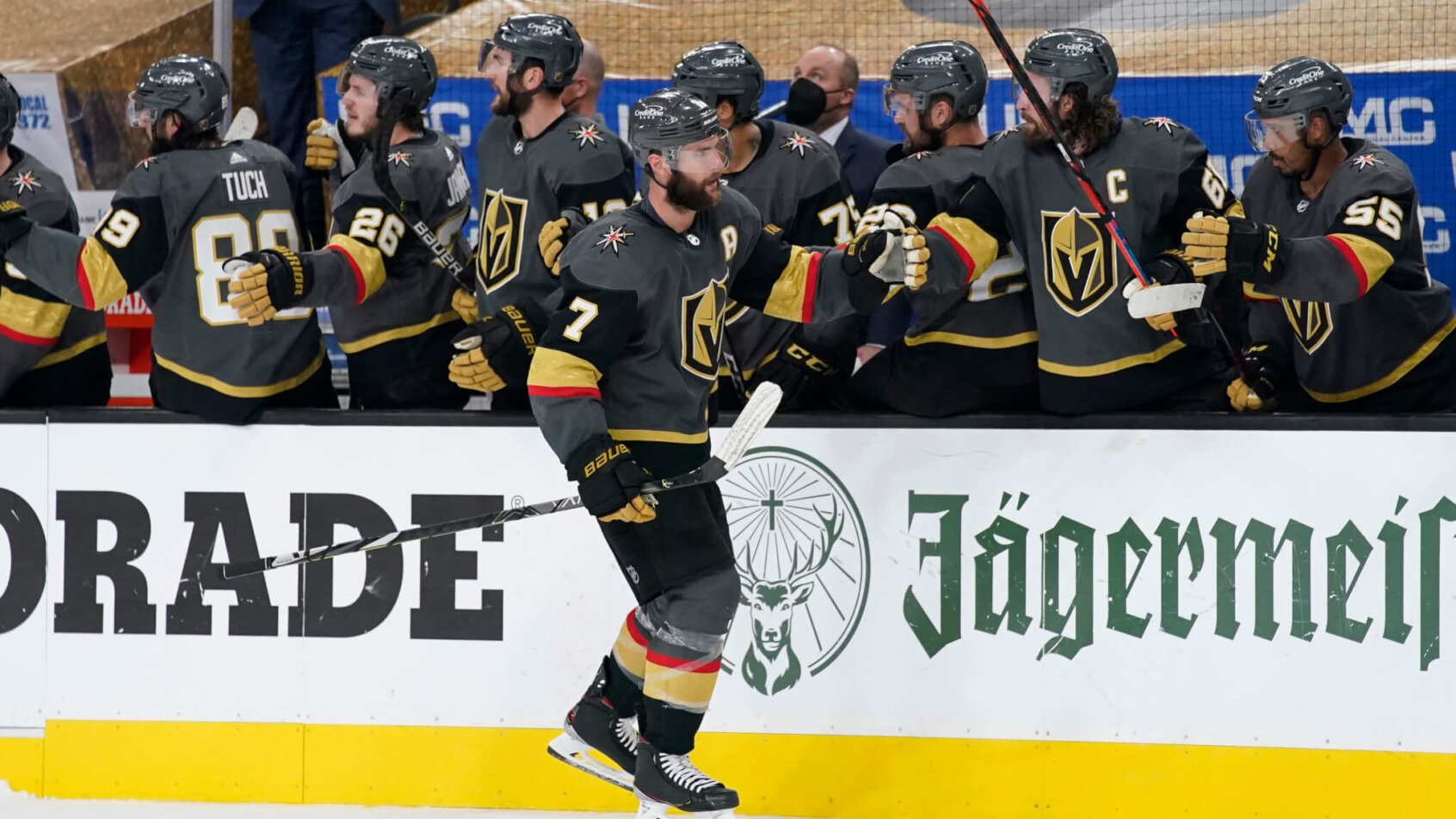 Alex Pietrangelo high-fives along bench