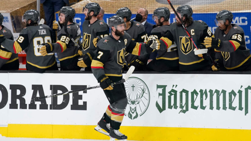 Alex Pietrangelo high-fives along bench