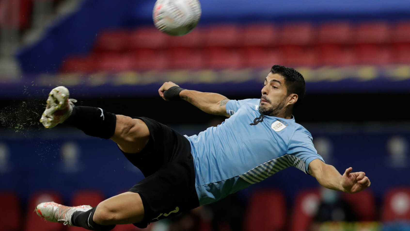 Uruguay's Luis Suarez taking a shot on net during a soccer match.