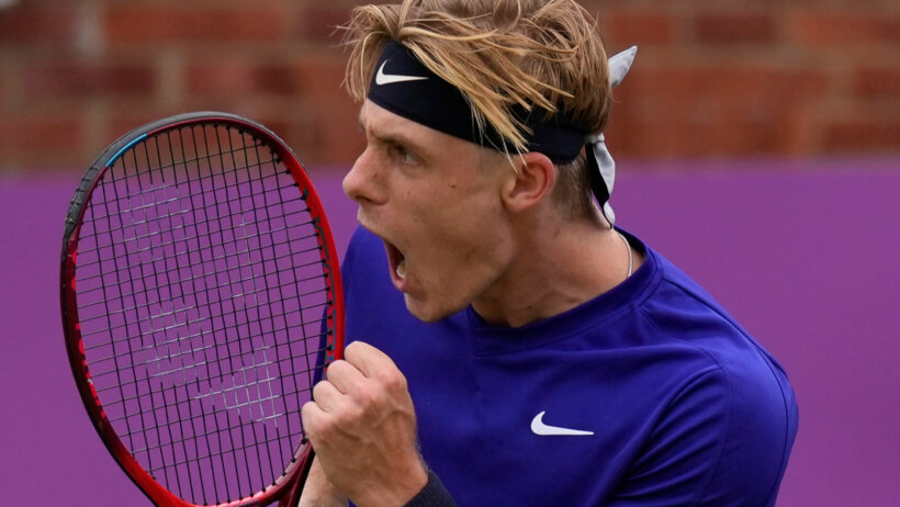 Denis Shapovalov celebrating after winning a point during a tennis match.
