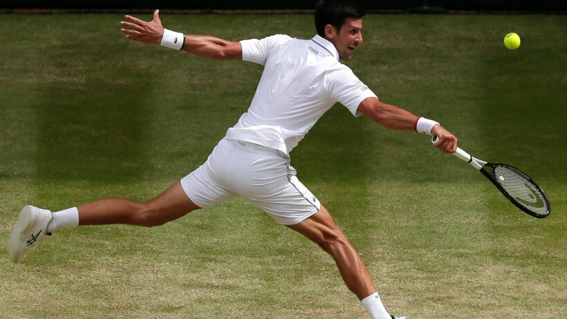 Novak Djokovic stretching for a return during a Wimbledon match