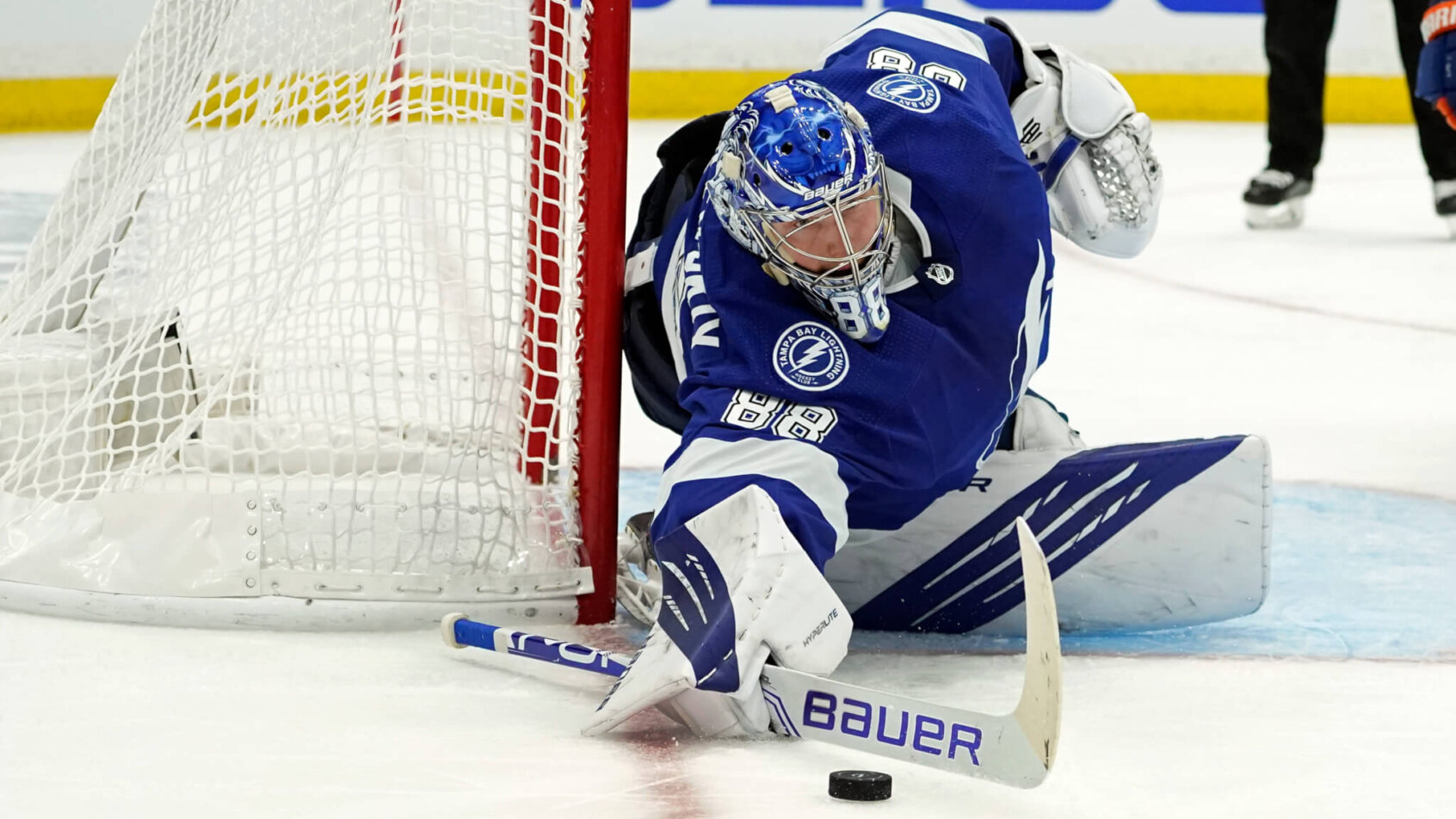 Tampa Bay Lightning goaltender Andrei Vasilevskiy making a save during a NHL game.