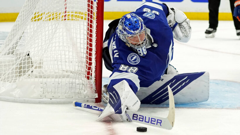 Tampa Bay Lightning goaltender Andrei Vasilevskiy making a save during a NHL game.