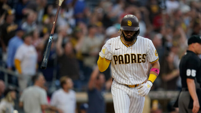 San Diego Padres' Fernando Tatis Jr. tossing his bat after hitting a home run during a game.