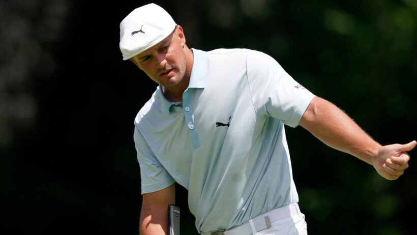 Bryson DeChambeau eyes a putt