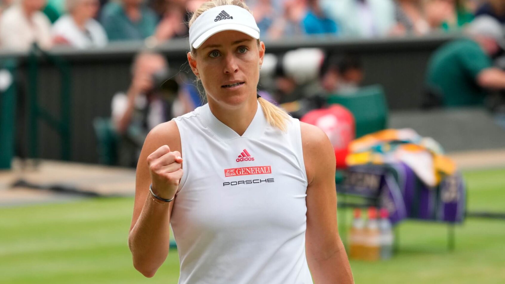 Angelique Kerber celebrating a point with a first pump during a tennis match.