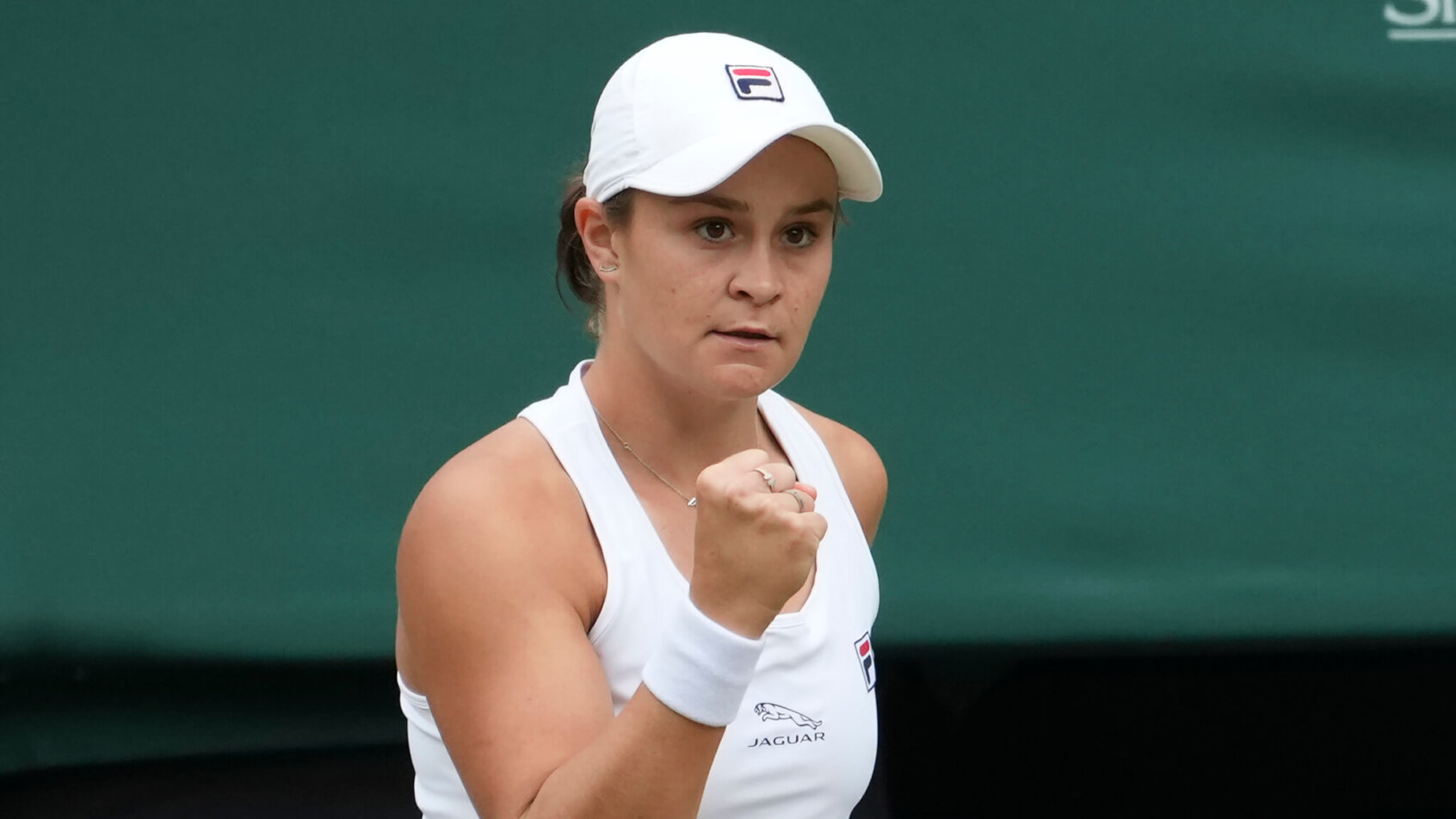 Ashleigh Barty celebrating winning a point with a fist pump.