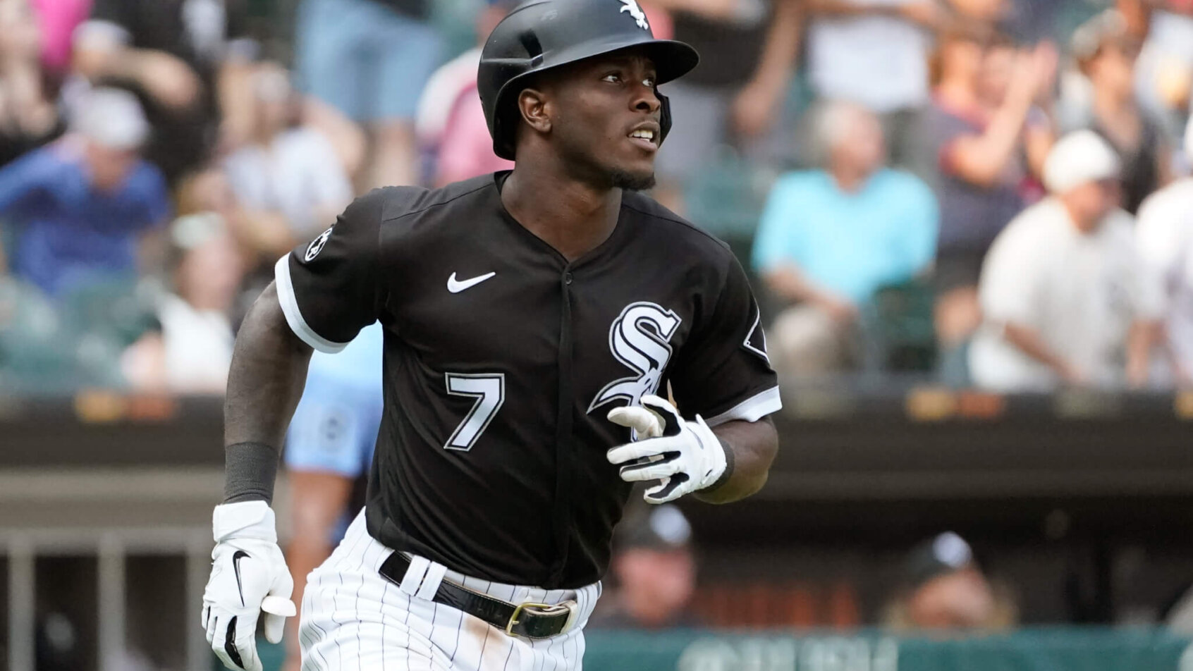 Chicago White Sox's Tim Anderson watching his home run after he hit it.