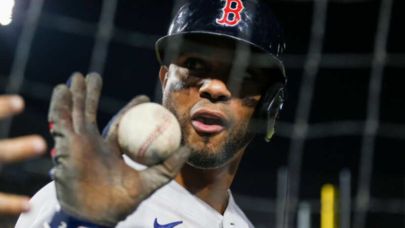 Xander Bogaerts holding a baseball