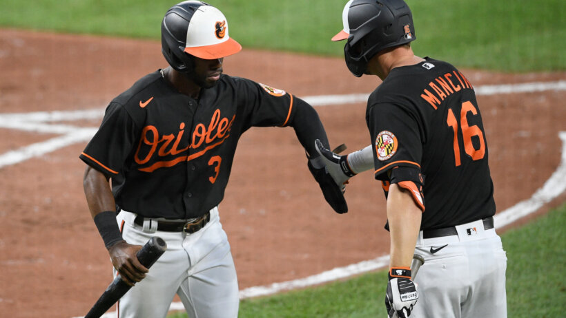 Orioles players celebrate after run scored