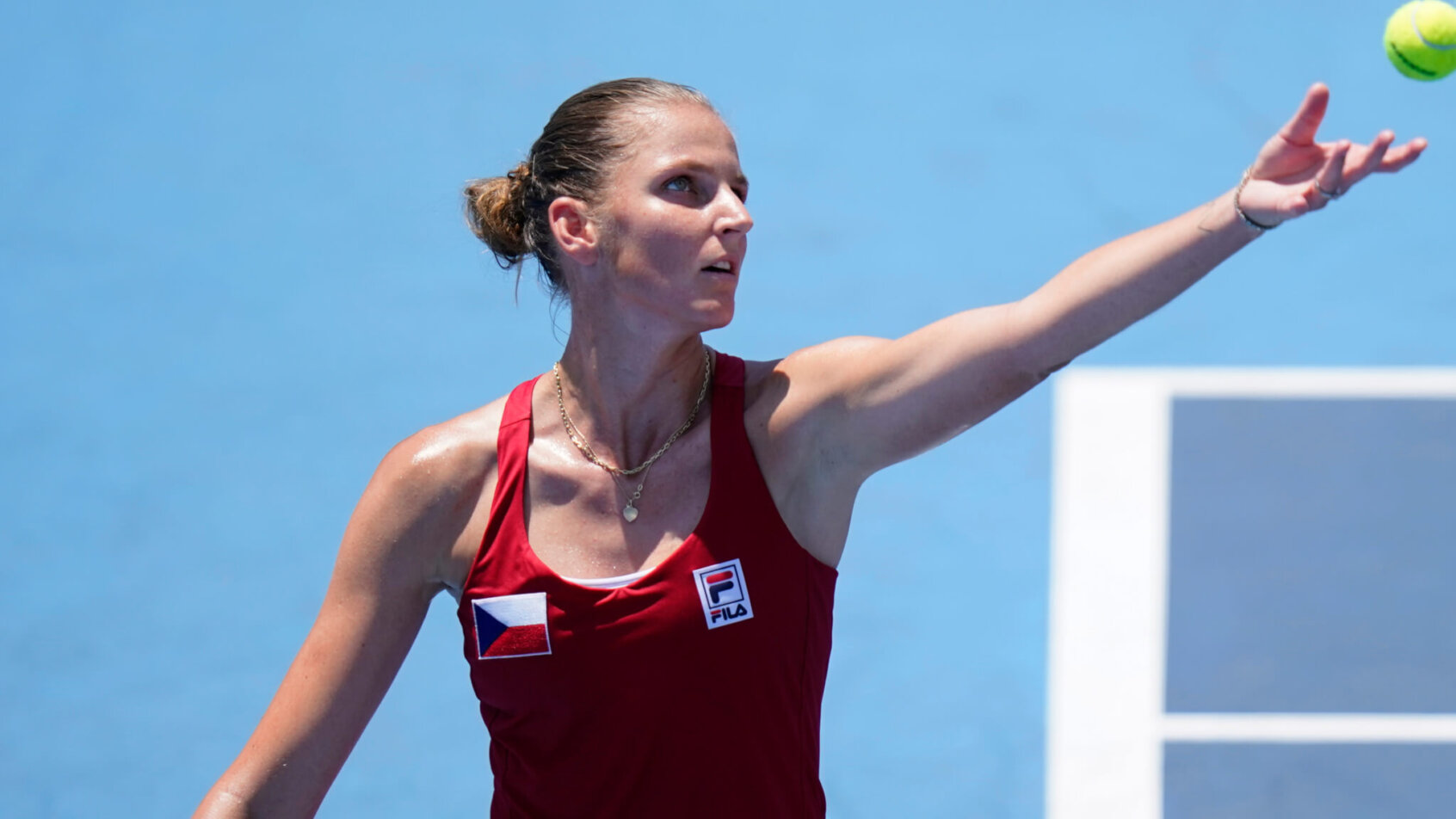 Karolina Pliskova serving the ball during a tennis match.