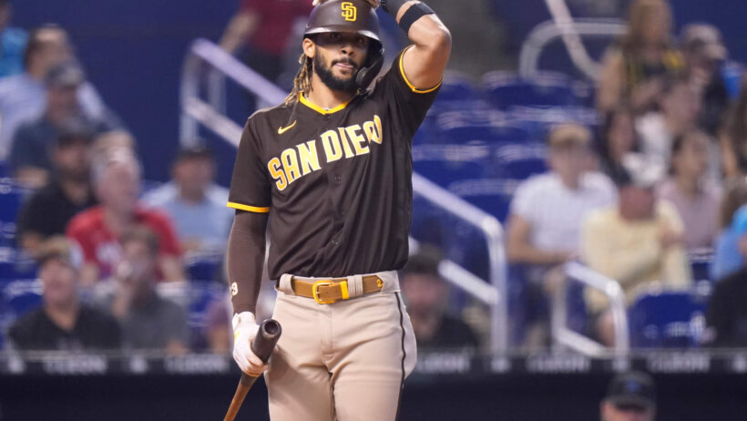 San Diego Padres' Fernando Tatis Jr adjusting between pitches