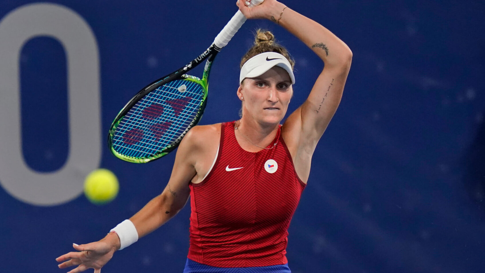 Marketa Vondrousova hitting a return against Naomi Osaka during a match at the Olympics.