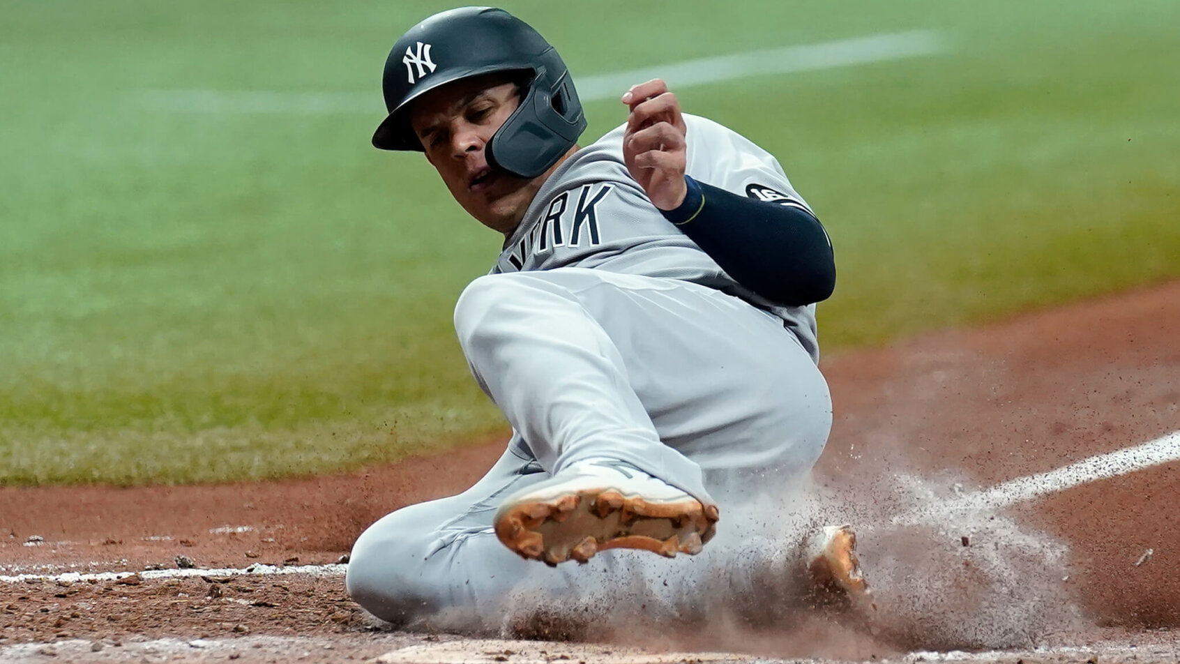 Gio Urshela slides into home