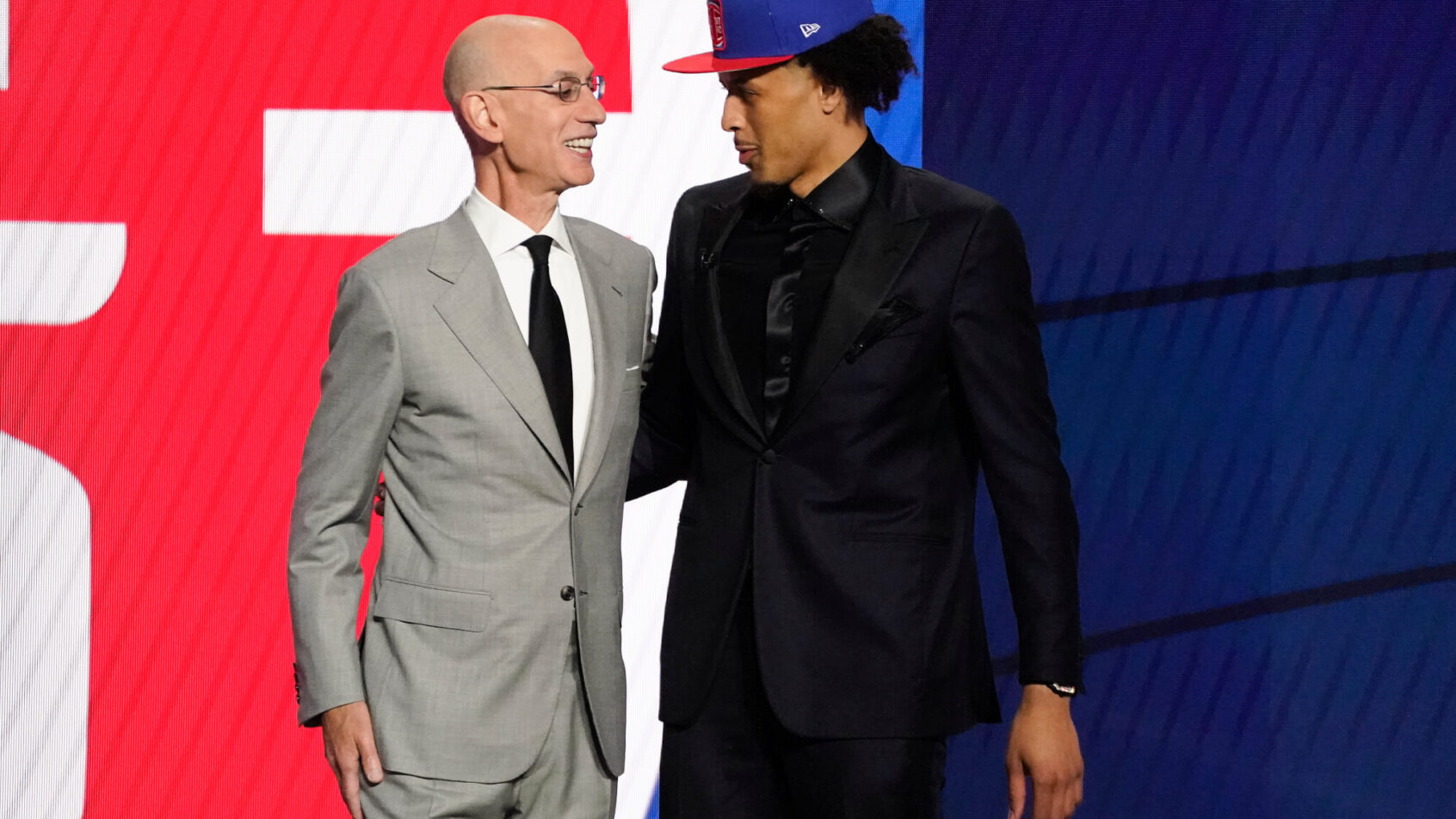 Adam Silver talking to Cade Cunningham