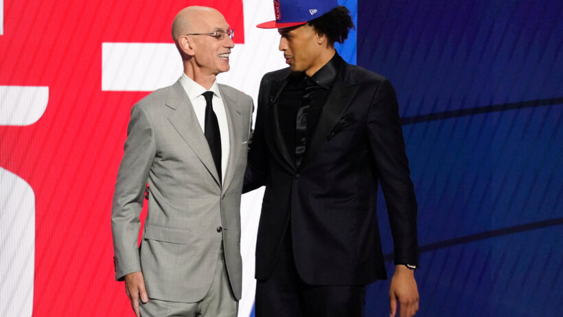 Adam Silver talking to Cade Cunningham