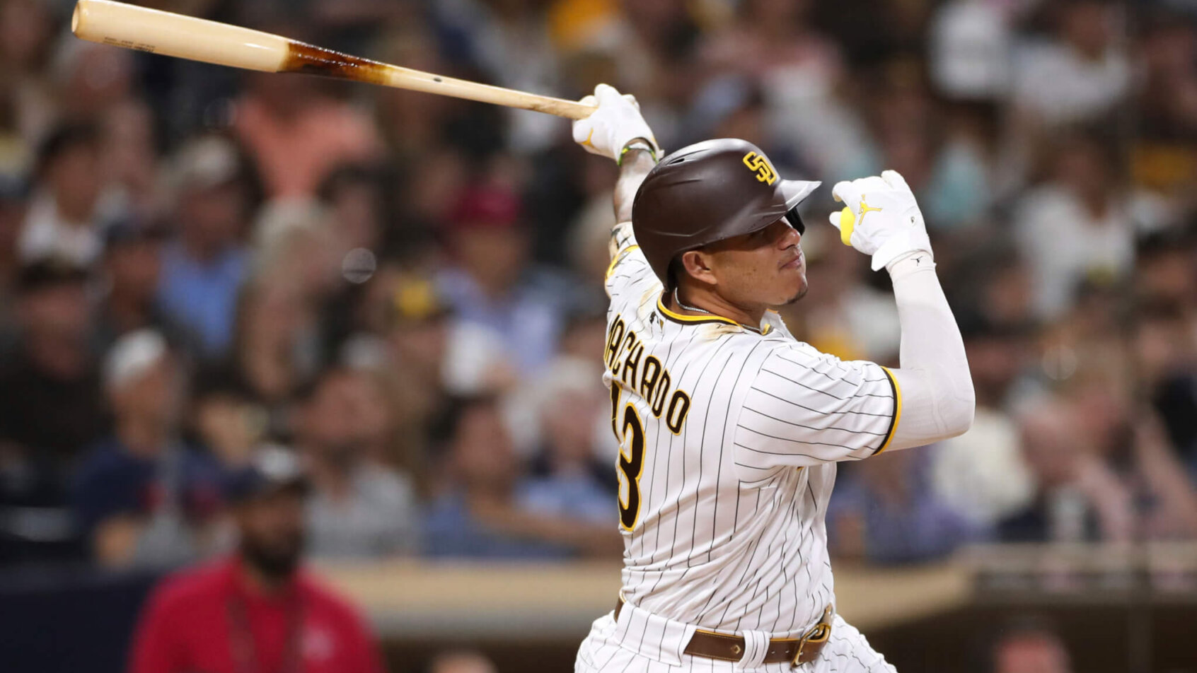 San Diego Padres' Manny Machado following through on his swing after he hit the ball.