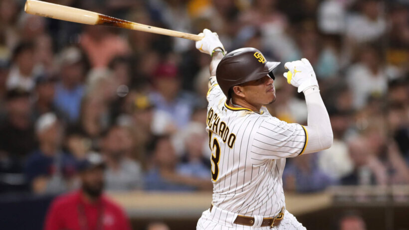 San Diego Padres' Manny Machado following through on his swing after he hit the ball.
