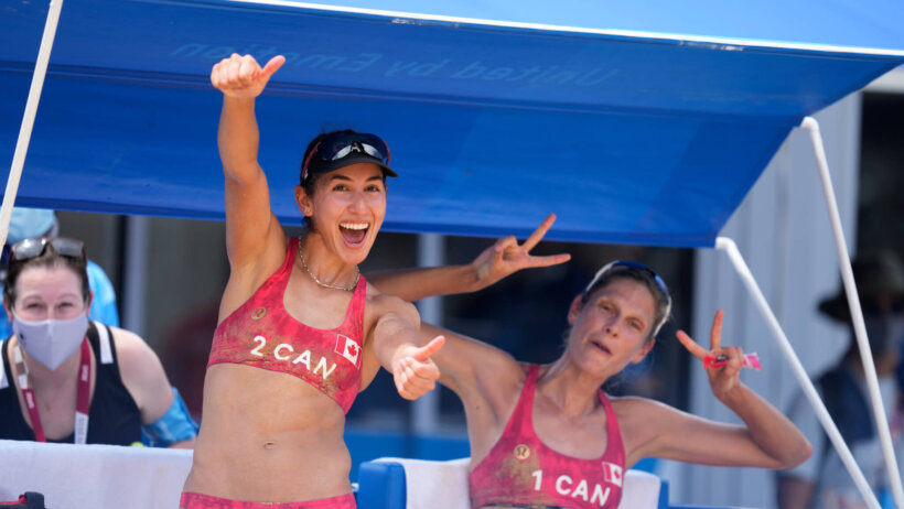 Sarah Pavan and Melisa Humana-Paredes celebrating after winning their beach volleyball match