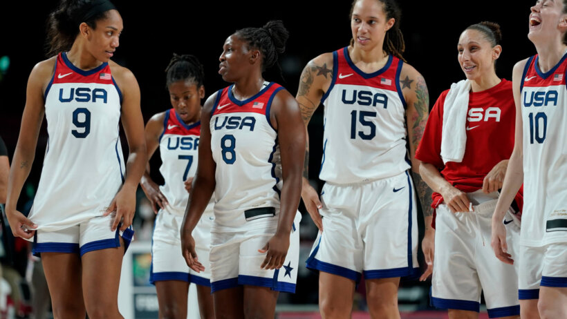 USA Women's Basketball players walking off the court after a win during the Olympics.