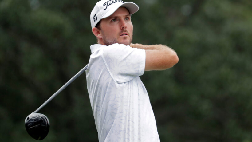 Russell Henley watching his drive