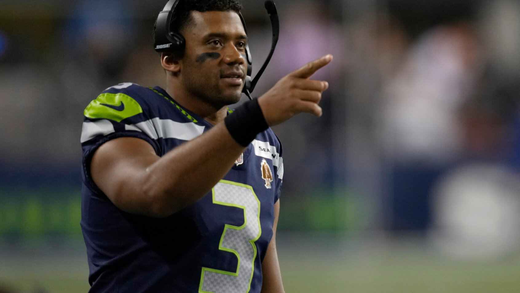 Russell Wilson gestures from sideline