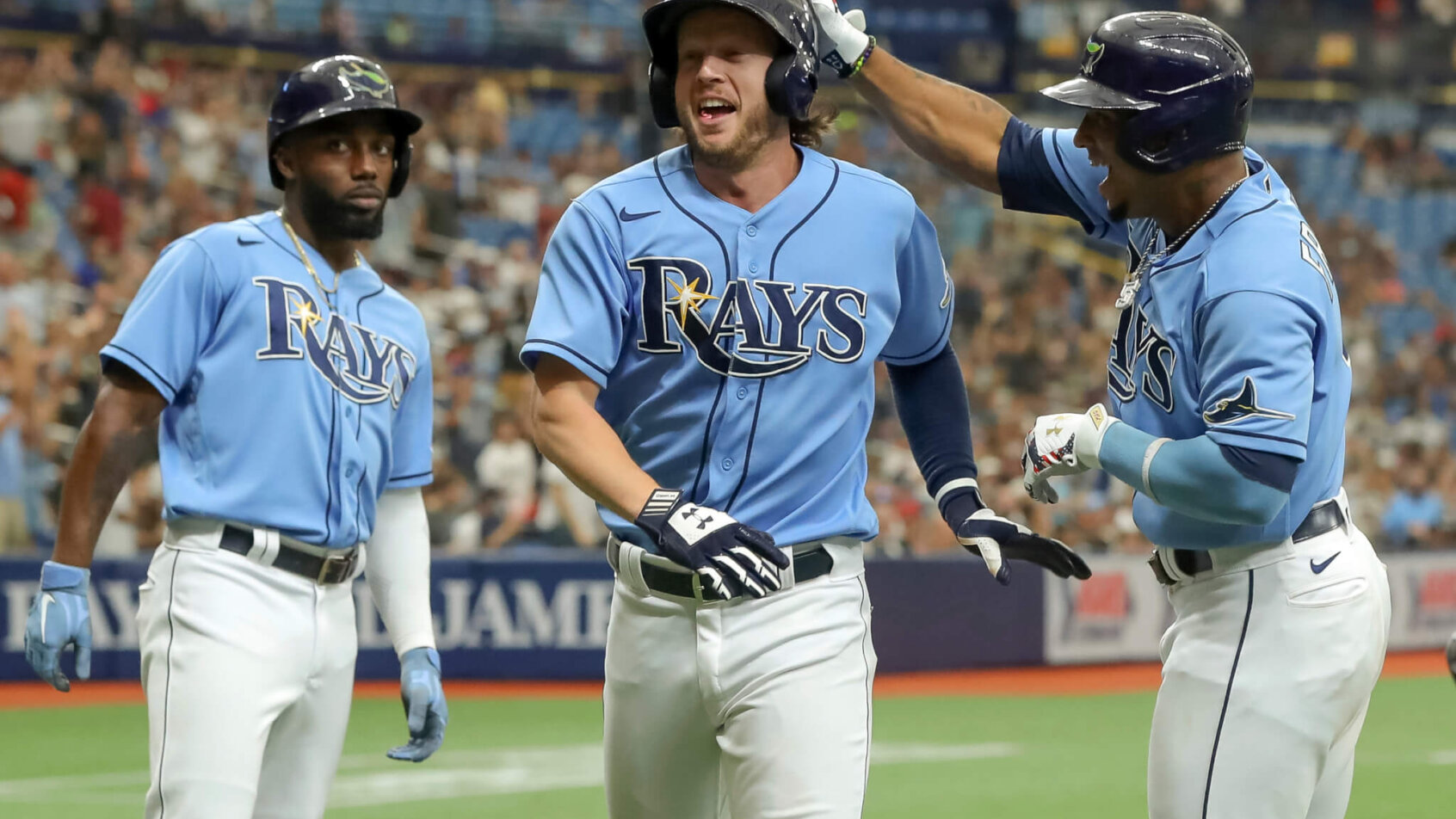Randy Arozarena, Brett Phillips and Wander Franco celebrating