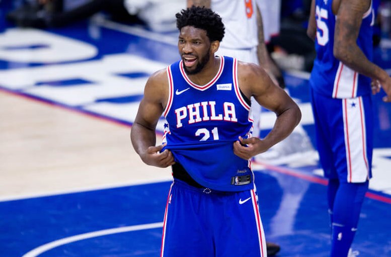 Joel Embiid pulling on bottom of jersey