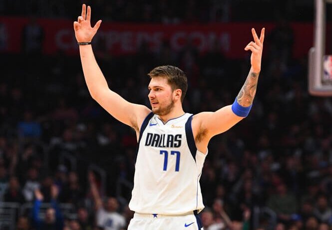 Luka Doncic hands up in the air