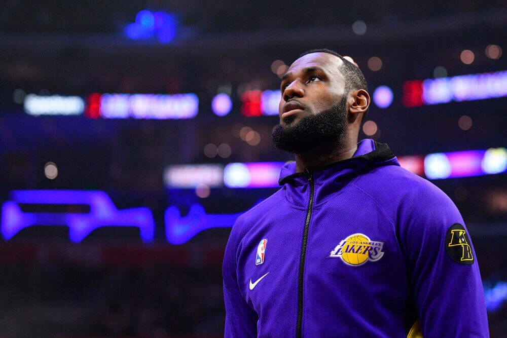 LeBron James stands for the anthem