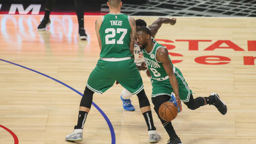 Kemba Walker dribbling around screen