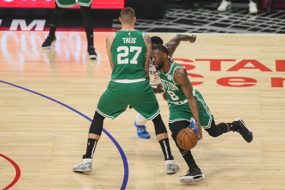 Kemba Walker dribbling around screen